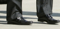 McCains actual feet. In his $520 shoes.